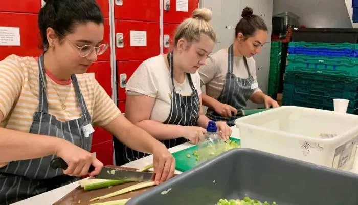 3 girl chopping vegetables